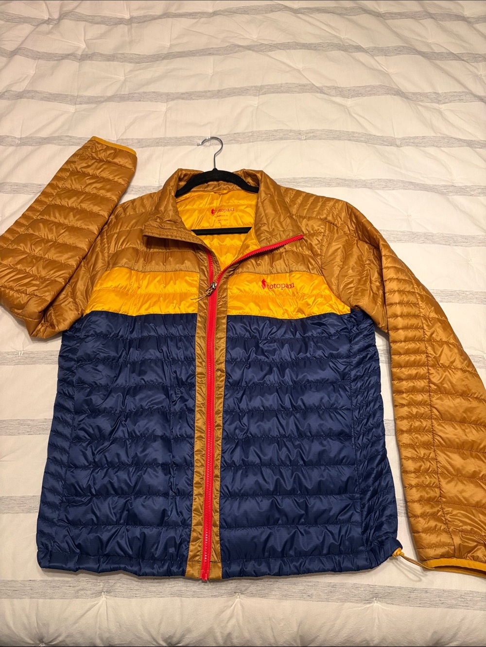 Cotopaxi Women’s Colorblock Puffer Jacket in Navy, Gold, Yellow